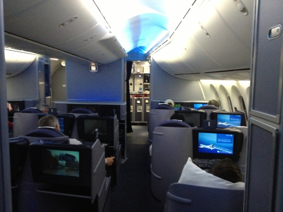 a group of people sitting in an airplane