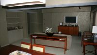 a living room with a television and a table