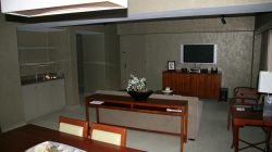 a living room with a television and a table