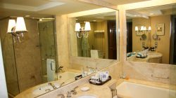 a bathroom with large mirrors