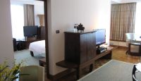 a room with a tv and a bed