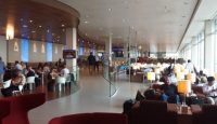 a large building with people sitting at tables