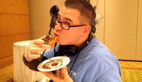 a man eating a hot dog