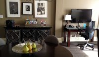 a room with a table and a television