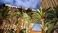 a hotel with palm trees