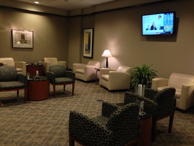 a room with chairs and a television