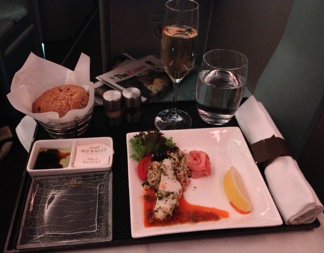a plate of food and drinks on a tray
