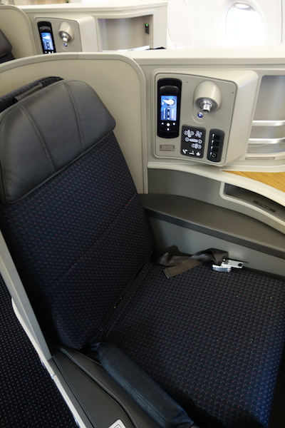 First Class seat with seat controls