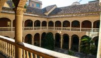 a building with many arches and a balcony