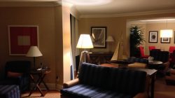 a living room with a couch and a lamp