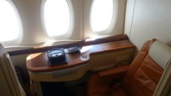 a table with a seat and windows in a plane