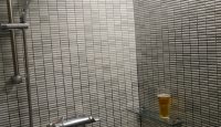 a glass shelf in a shower
