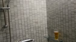 a glass shelf in a shower