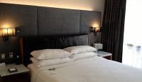 a bed with pillows and a headboard