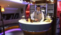 a man standing behind a bar
