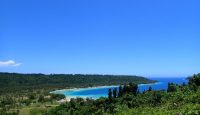 a landscape with a body of water and a beach