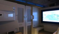 a room with a television and a screen