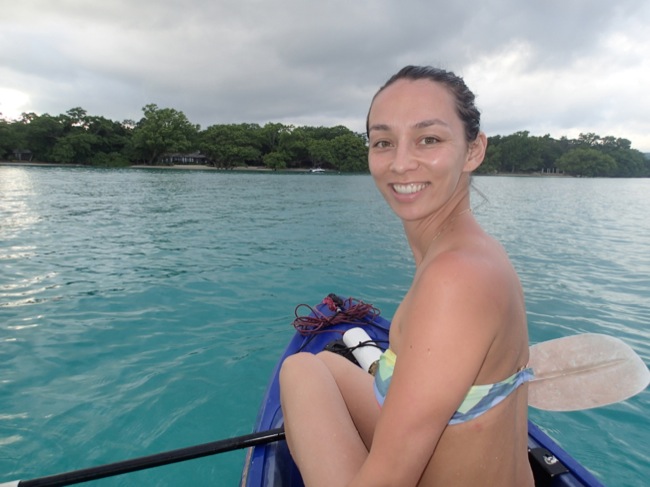 a woman in a garment on a kayak