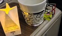 a cup and a bag on a table