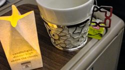 a cup and a bag on a table