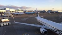 a group of airplanes at an airport