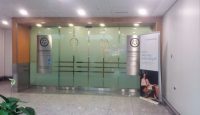 a glass door with signs in front of it