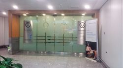 a glass door with signs in front of it
