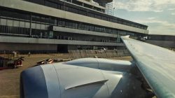 a plane wing in front of a building