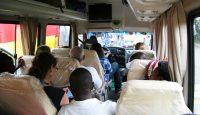 a group of people sitting in a bus