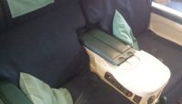 a seat with armrests and arm rest