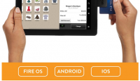 a person holding a tablet with a credit card in the screen