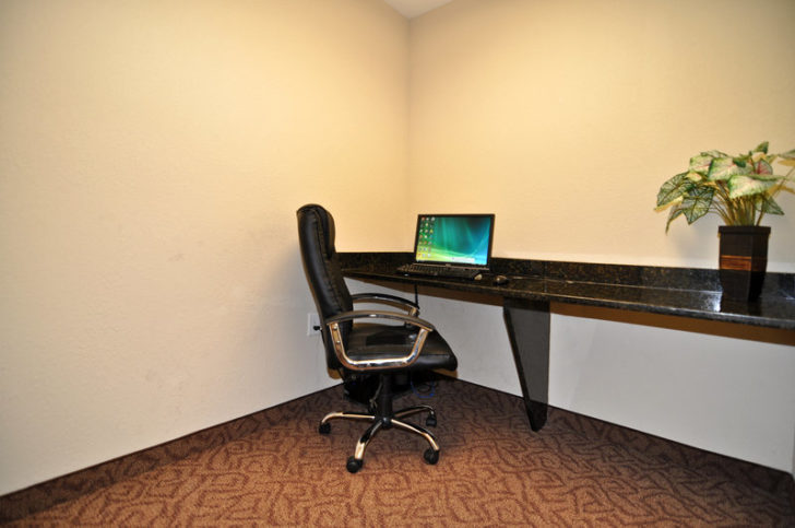 a laptop on a desk in a room