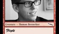 a man wearing glasses and smiling