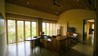 a room with a desk and a television