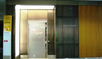 a glass door next to a door