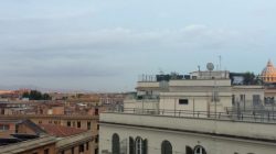 a group of buildings with a cloudy sky