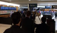 a group of people in a terminal