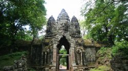 a stone structure with a face carved into it