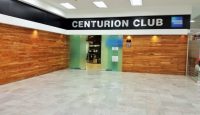 a room with a sign and wood walls
