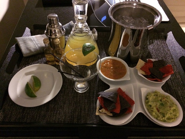 a table with a drink and food