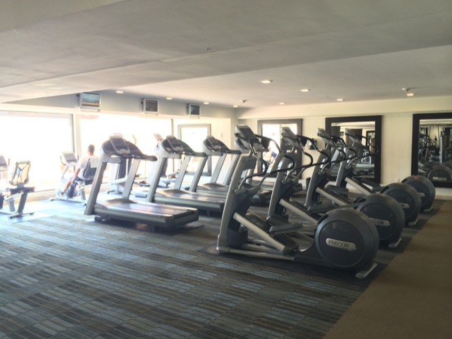 a group of treadmills in a gym