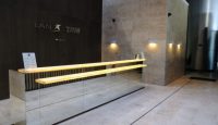 a glass railing in front of a wall