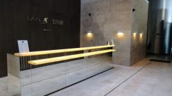 a glass railing in front of a wall