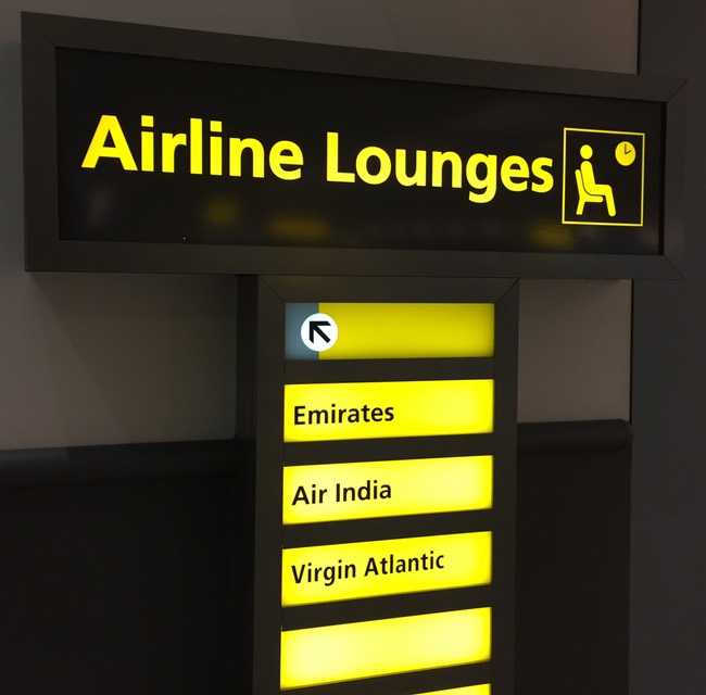 a sign with yellow text and black text