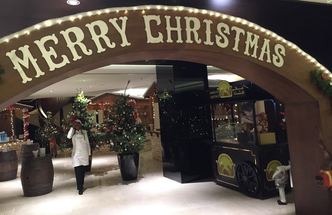 a person walking in front of a sign