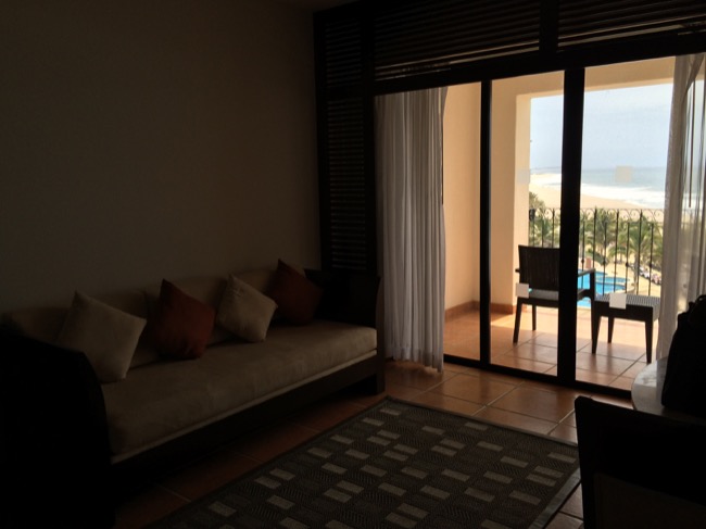 a room with a couch and a glass door