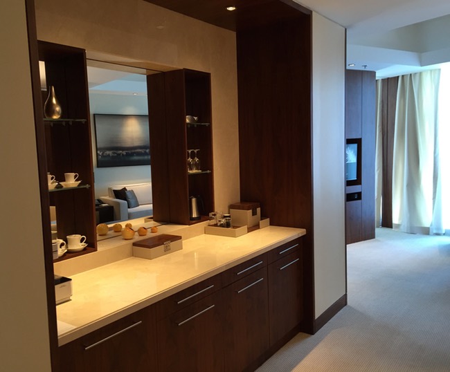 a room with a mirror and a table