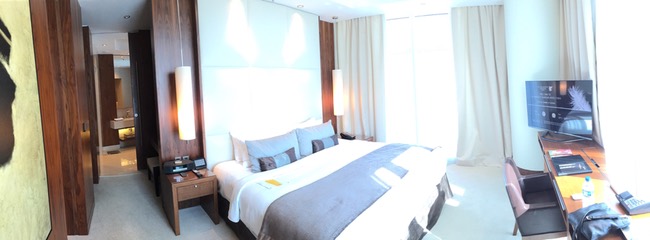 a bed with a lamp in a room