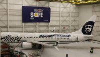 a white airplane in a hangar