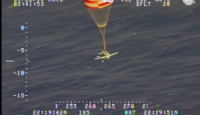 a plane flying with a parachute